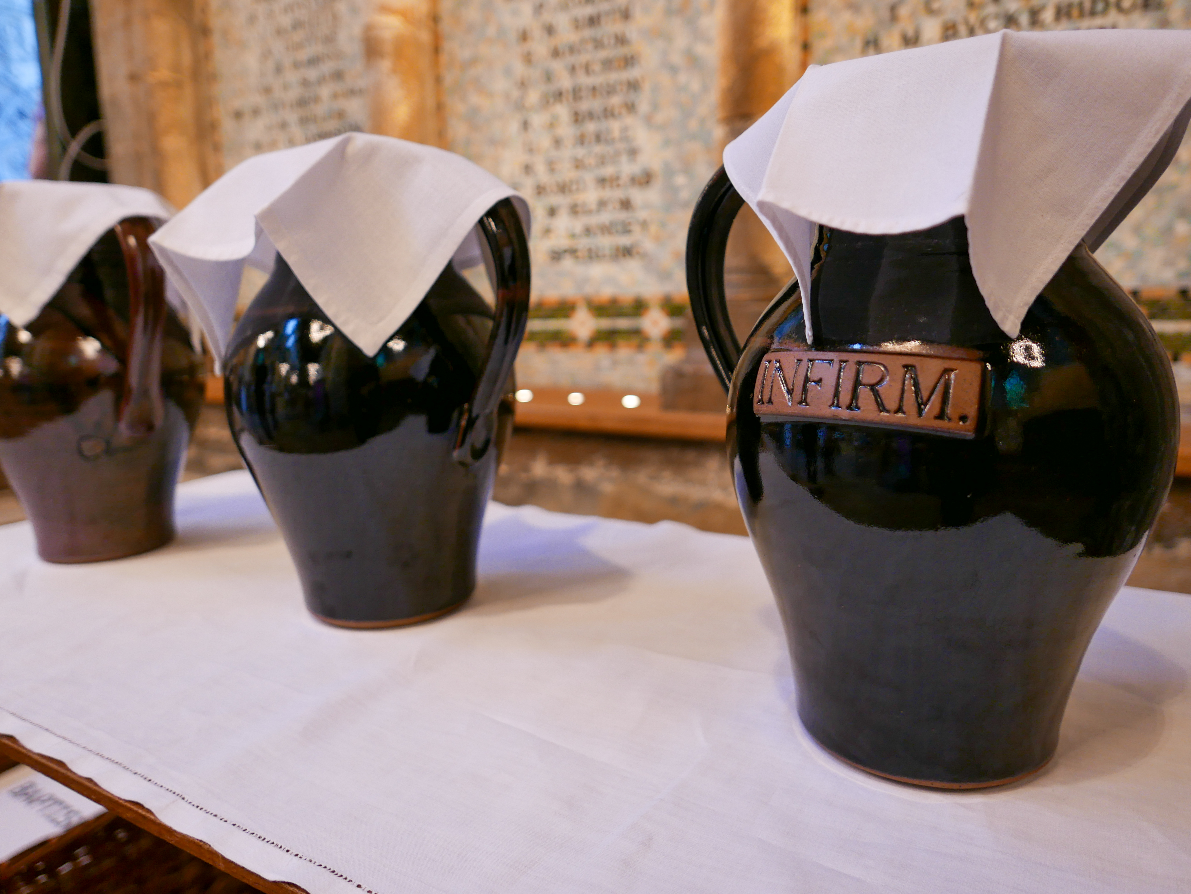 Jars of oil are lined up in a row