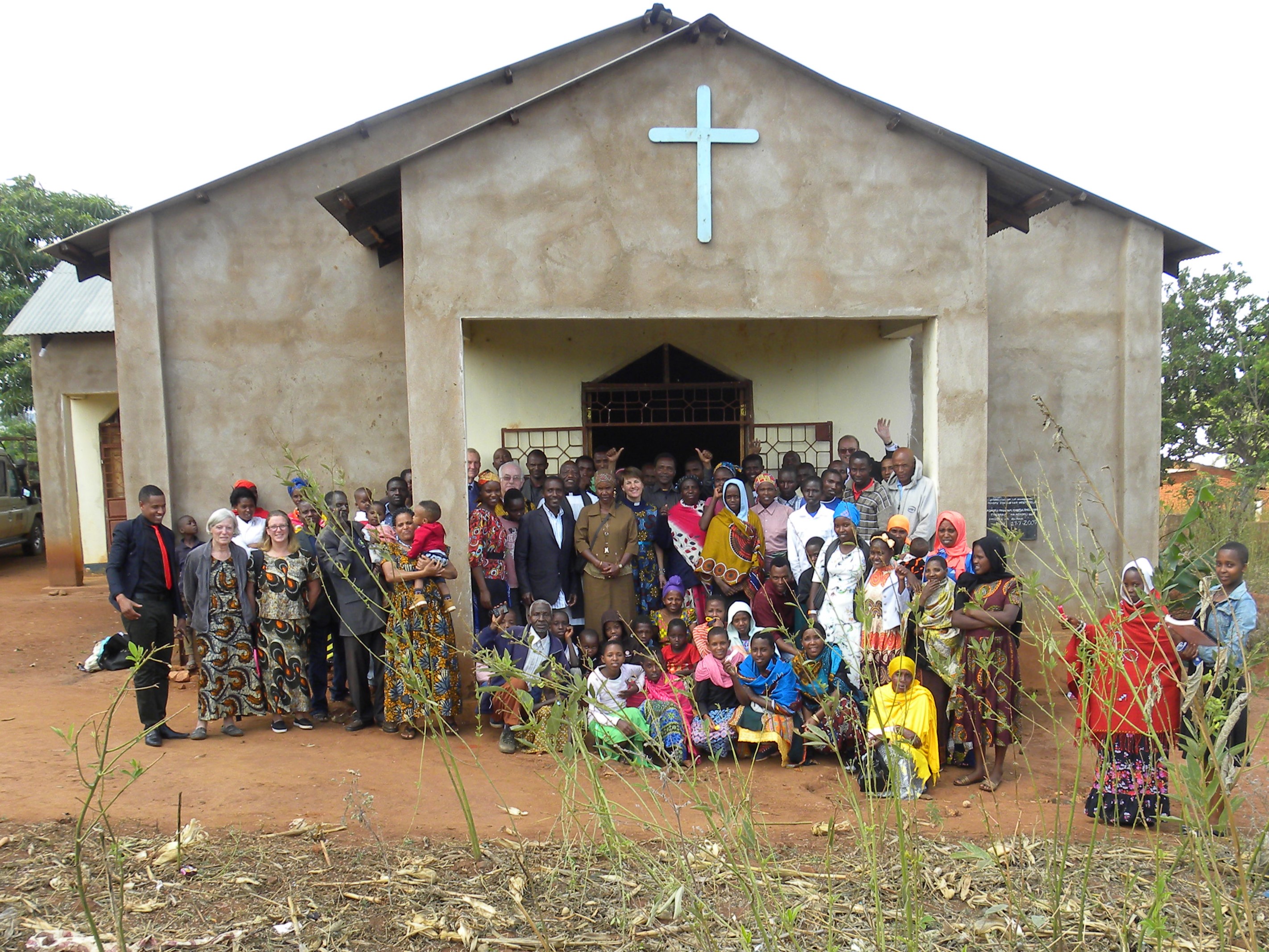 A congregation with visitors from Paddock Wood gather outside a church in Bereko