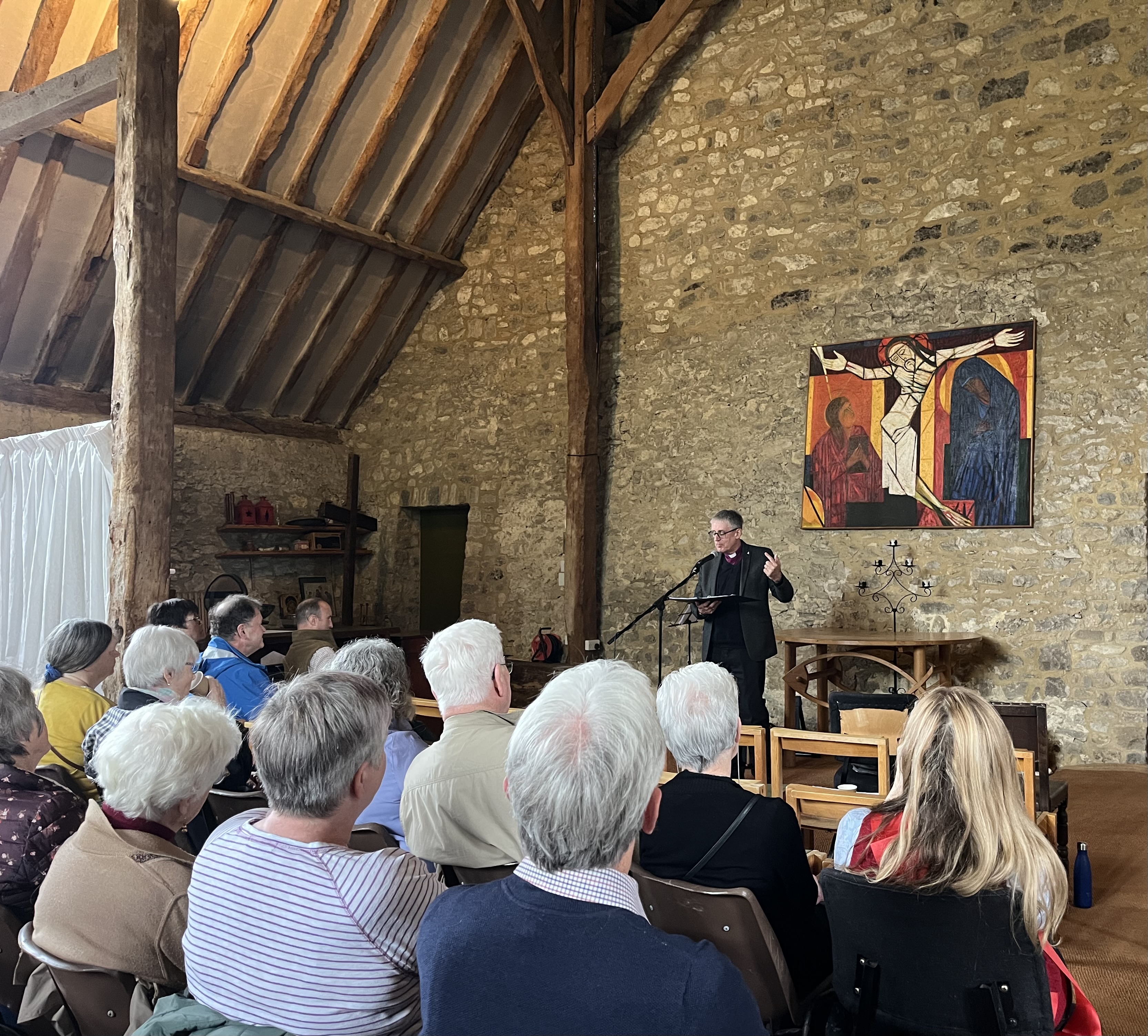 Bishop Simon talks from a lectern