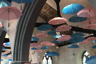 Open Umbrellas in church mark baby loss awareness week. 